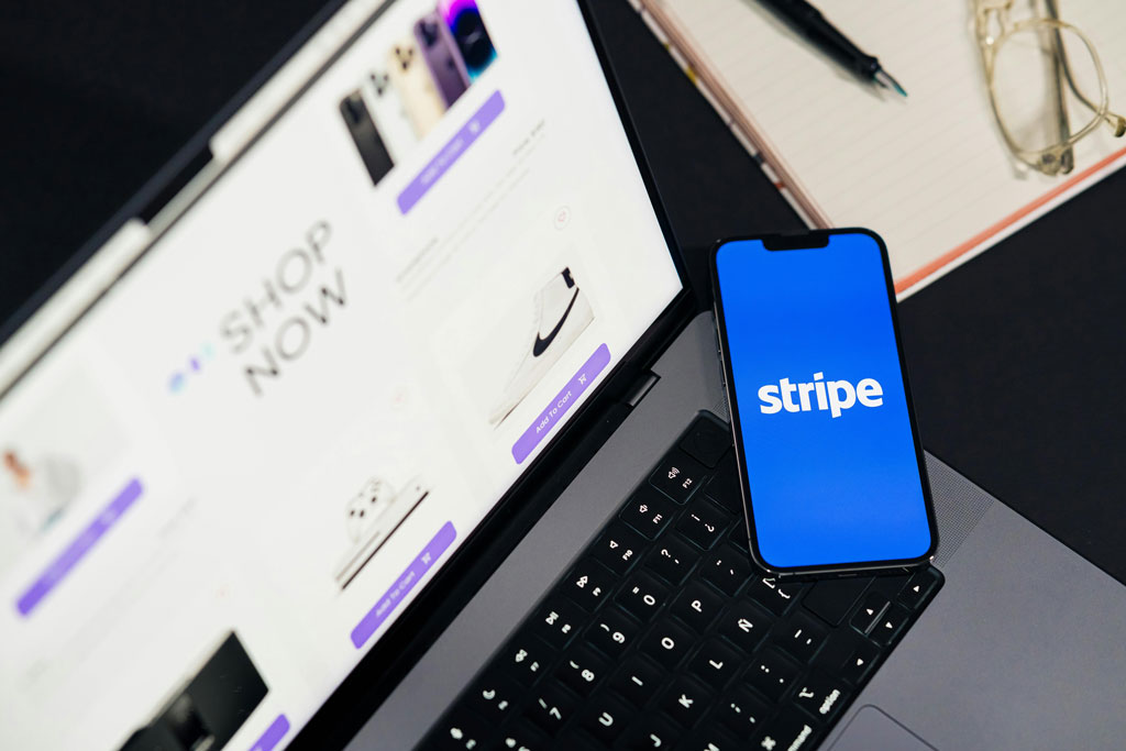 E-Commerce Development Services showing an online store checkout with Stripe payment integration on mobile and laptop devices